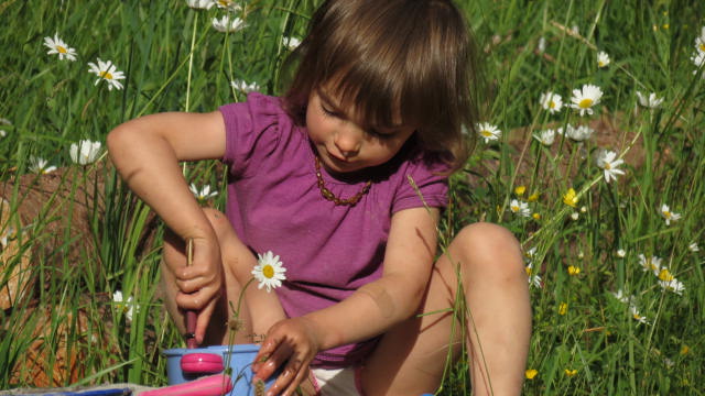 Mia cooks in the garden