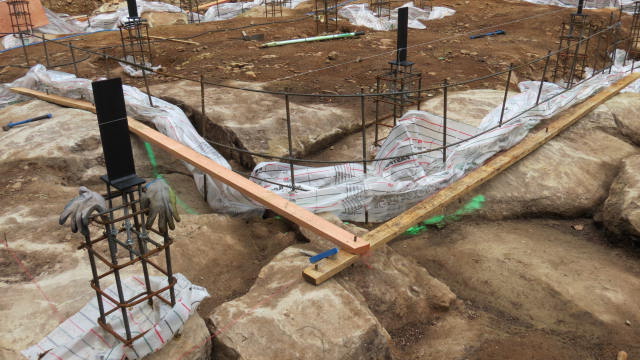 The uneven rock and the footer 2X4s for our curved wall